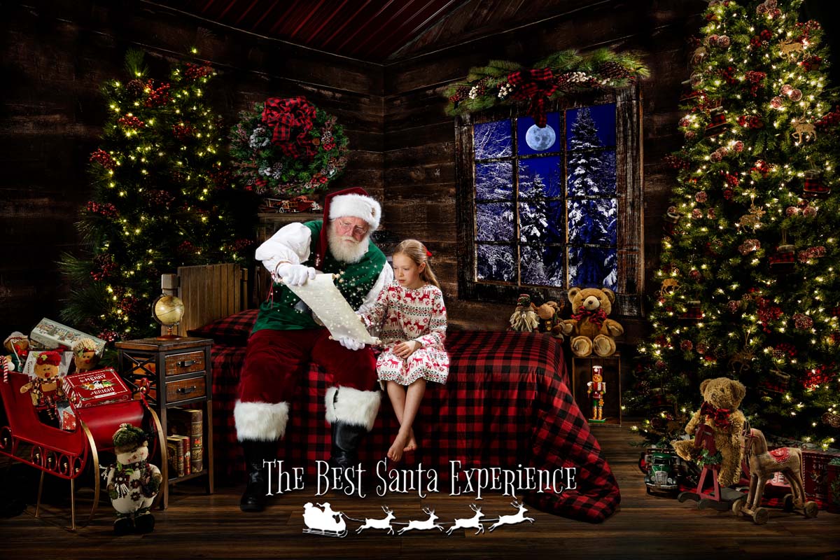 A young girl finds her name on Santa's Nice List at The Best Santa Experience.