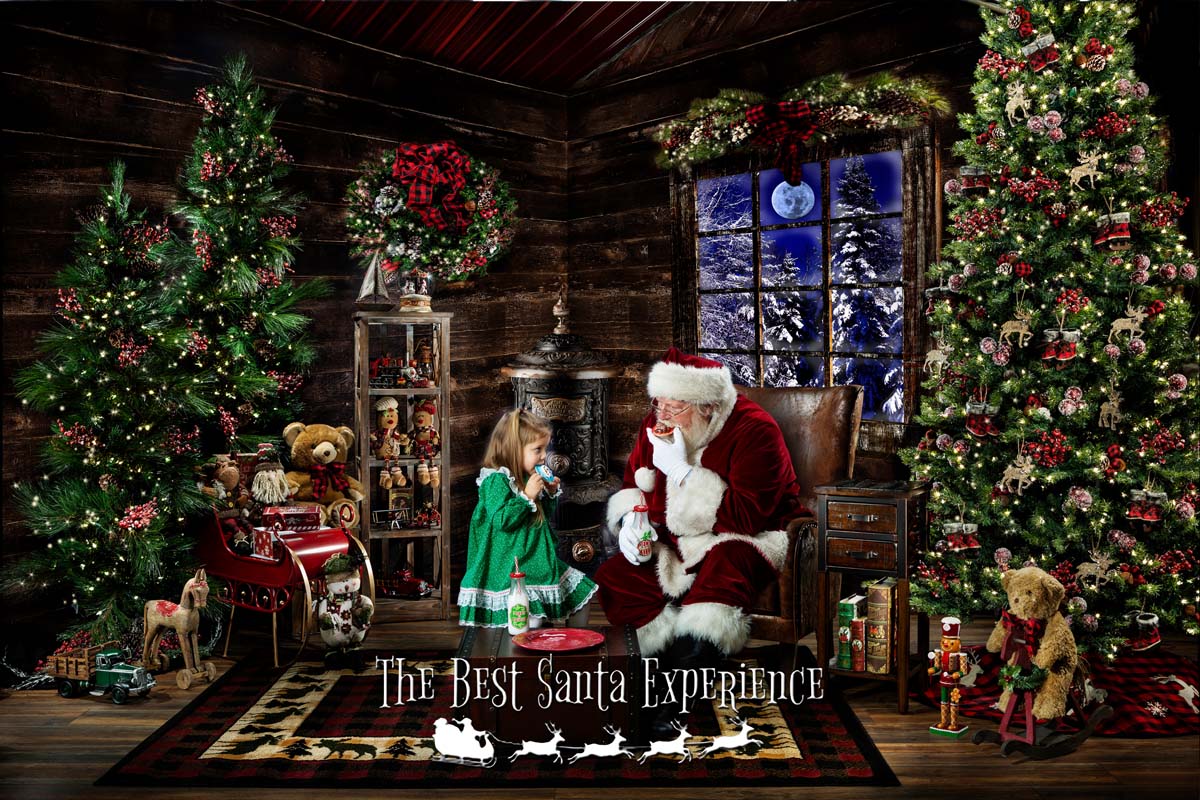Santa enjoys a snack of milk and cookies with a cute little girl right there in Santa's Cabin!