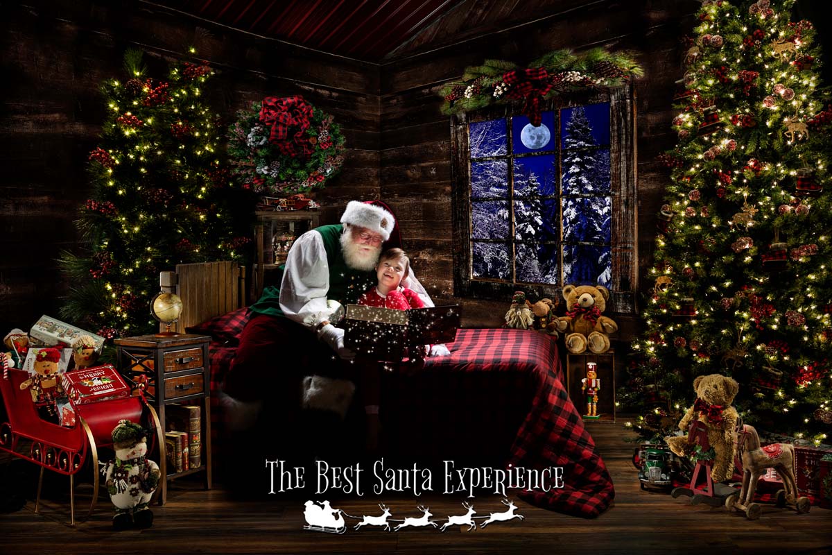 A cute little boy hears Santa read The Night Before Christmas from his Magic Book at The Best Santa Experience.
