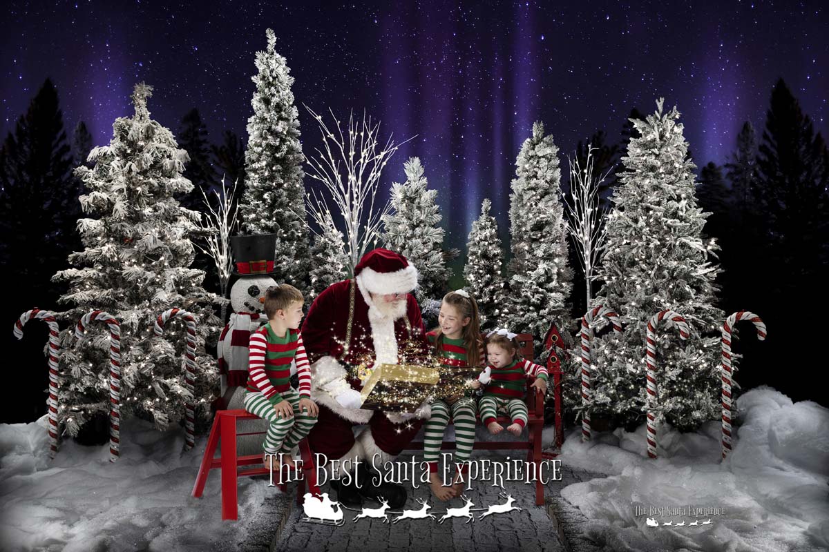 Three adorable siblings hear stories from Santa's Magic Book at The Best Santa Experience.
